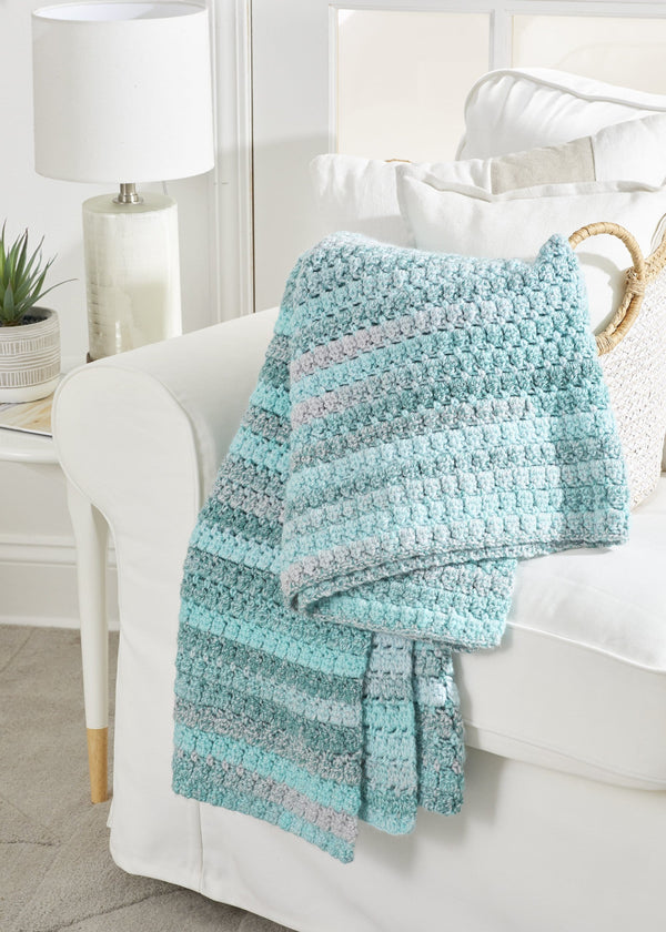 Premier Yarns - This gorgeous colorway will keep you snug all year 'round.  Pattern: Arden Throw (link in comments) Yarn: Premier® Yarns Puzzle™ Color:  1050-18 Dominoes . . #premieryarns #makeitpremier #expressyourpassion #yarn  #
